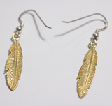 Sterling silver drop earrings with brass feathers attached from Cloud Publishing