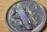 Australian pipe opal with the colours of the rainbow from Cloud Publishing