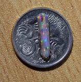 Australian pipe opal with the colours of the rainbow from Cloud Publishing