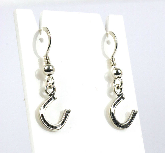 Sterling silver horseshoe drop earrings.