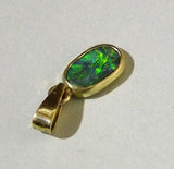 Black opal 14k gold pendant with green blue red and orange colours from Cloud Publishing