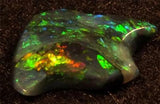 BLACK OPAL Red Green Gold abstract "Swallow"  art stone One of a Kind 1carat