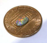 red green blue dark Australian opal gemstone from Cloud Publishing