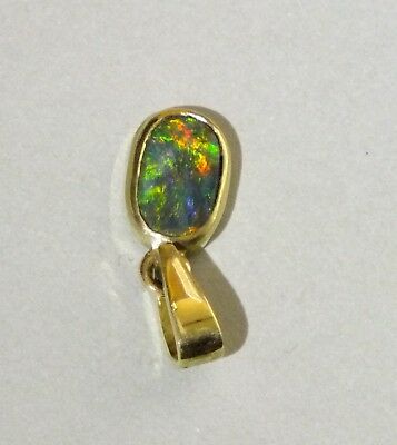 Black opal 14k gold pendant with green blue red and orange colours from Cloud Publishing