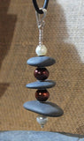 Beach Stone and Pearl Cairn style Pendant with Sterling Silver Wire, beads and Santoprene Cord. A touch of Zen